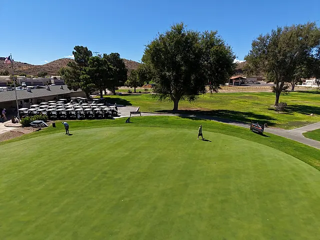 Golfers and partners on the course at the King of the Desert Classic.