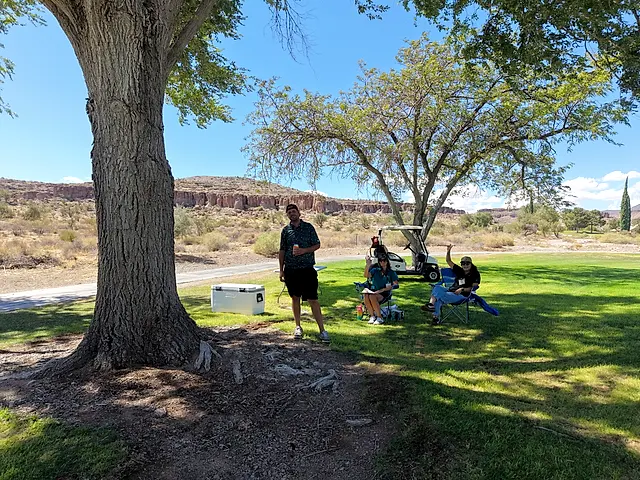 Golfers and partners on the course at the King of the Desert Classic.