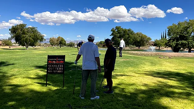 Golfers and partners on the course at the King of the Desert Classic.