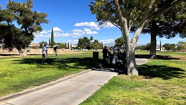 Golfers and partners on the course at the King of the Desert Classic.