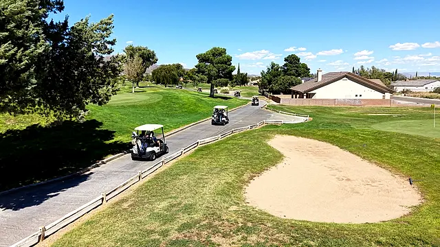 Golfers and partners on the course at the King of the Desert Classic.