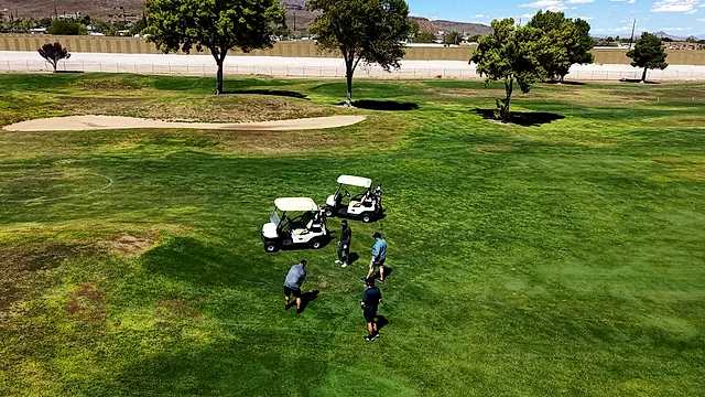 Golfers and partners on the course at the King of the Desert Classic.