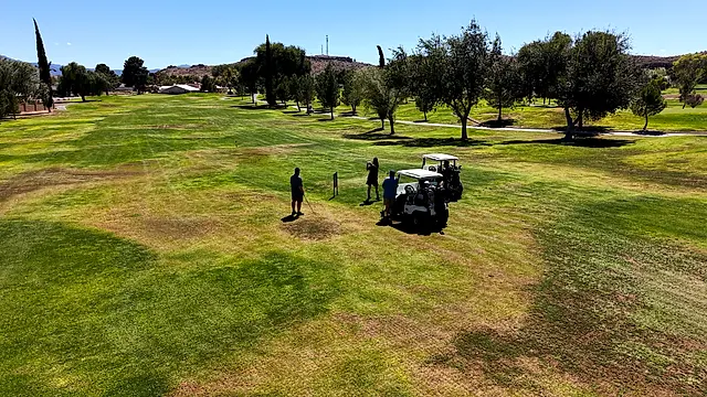 Golfers and partners on the course at the King of the Desert Classic.