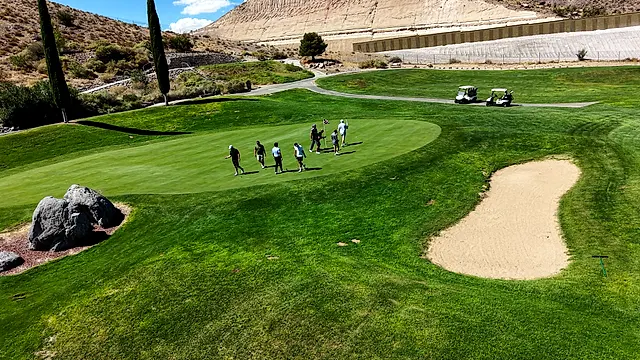 Golfers and partners on the course at the King of the Desert Classic.